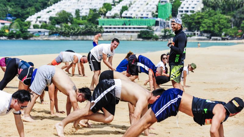 People working out at the unique Clean the Beach Boot Camp, Phuket Thailand