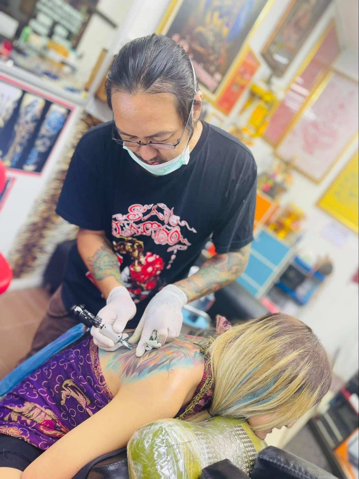 Tattoos with the special UV-sensitive ink getting designed at the Sam Tattoo Studio, Chiang Mai