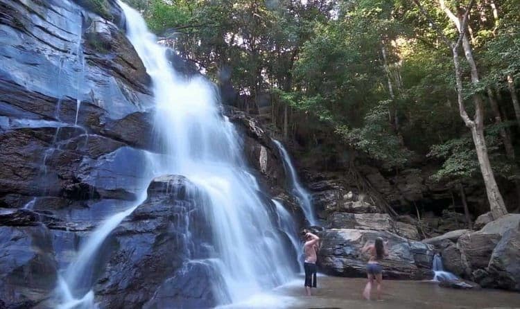 Tourists taking a refreshing bath at Tad Mork Waterfall, Chiang Mai