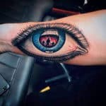 Famous One Eye Symbol Tattoo on Customer at Mr. Tattoo