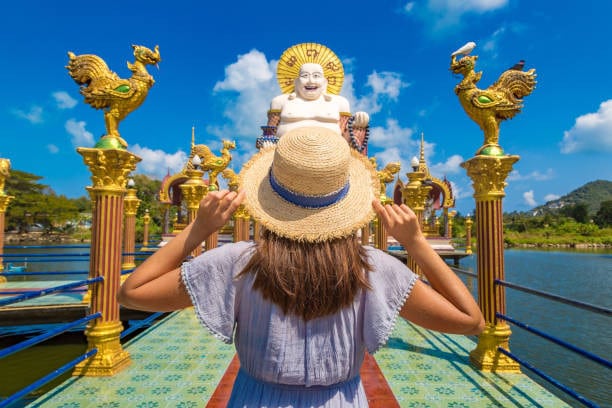 Tourist Facing Towards Guanyin Statue at Wat Plai Laem