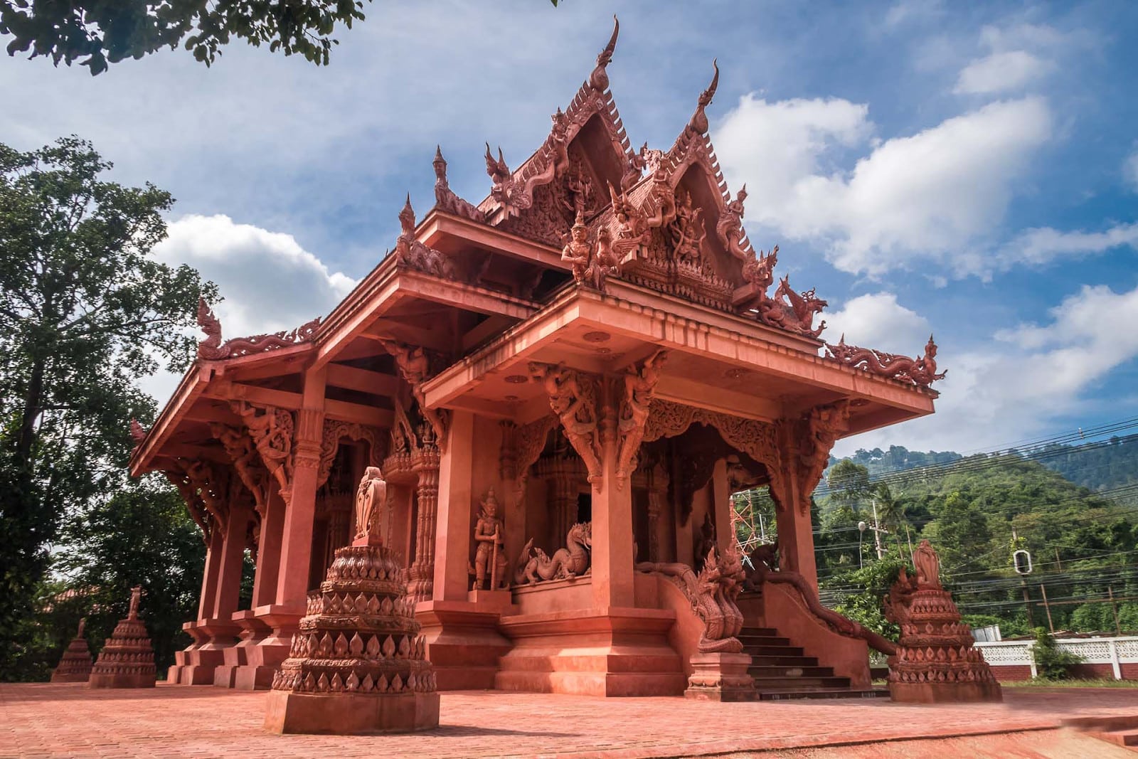 Island’s Attraction. Red Clay Structure of Wat Ratchathammaram
