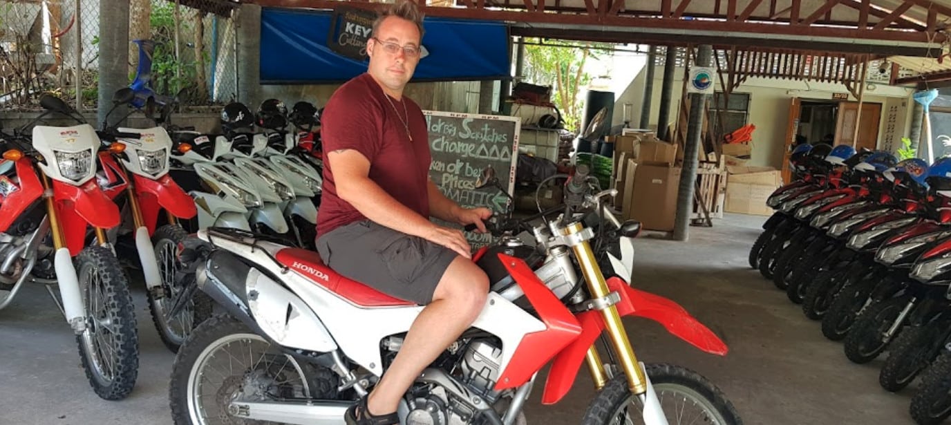 Man on a bike at RPM bike rental Shop, Koh Tao