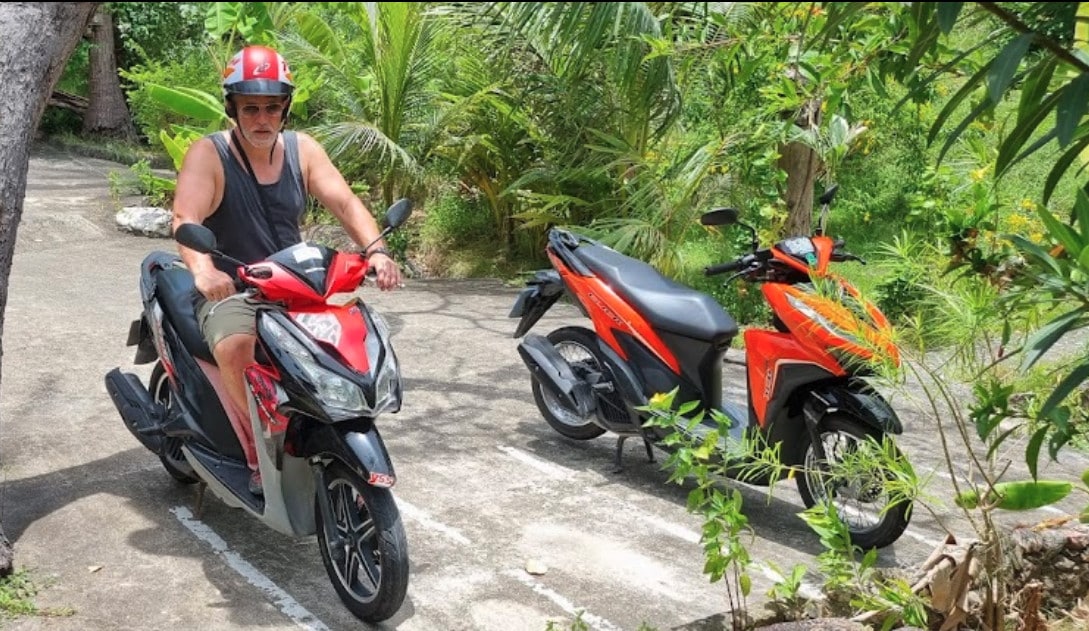 Man on a rental bike in Koh Tao