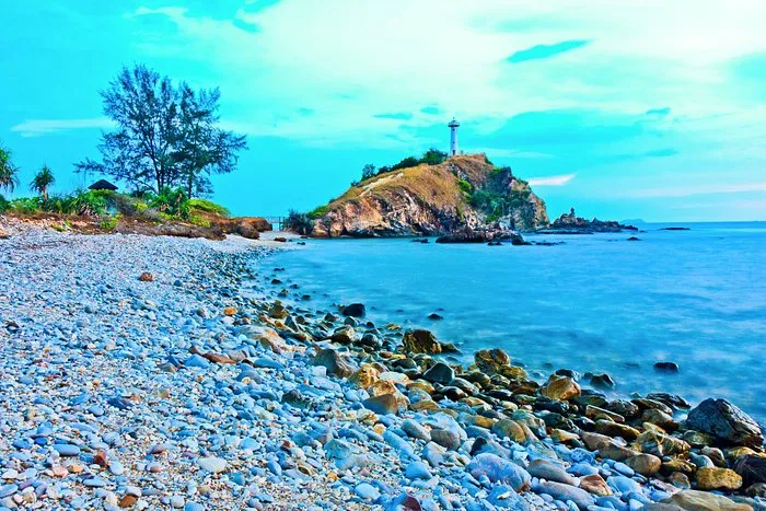 The view of Koh Lanta lighthouse across the beach shore