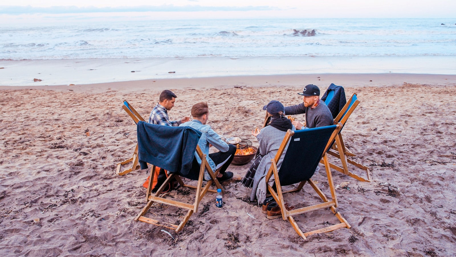 A group of friends enjoying beach barbeque