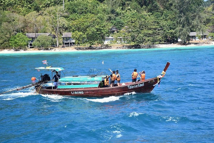 Visitors enjoying a boat ride on Kantiang Bay