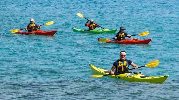 Travelers enjoying kayaking on Klong Jark Beach