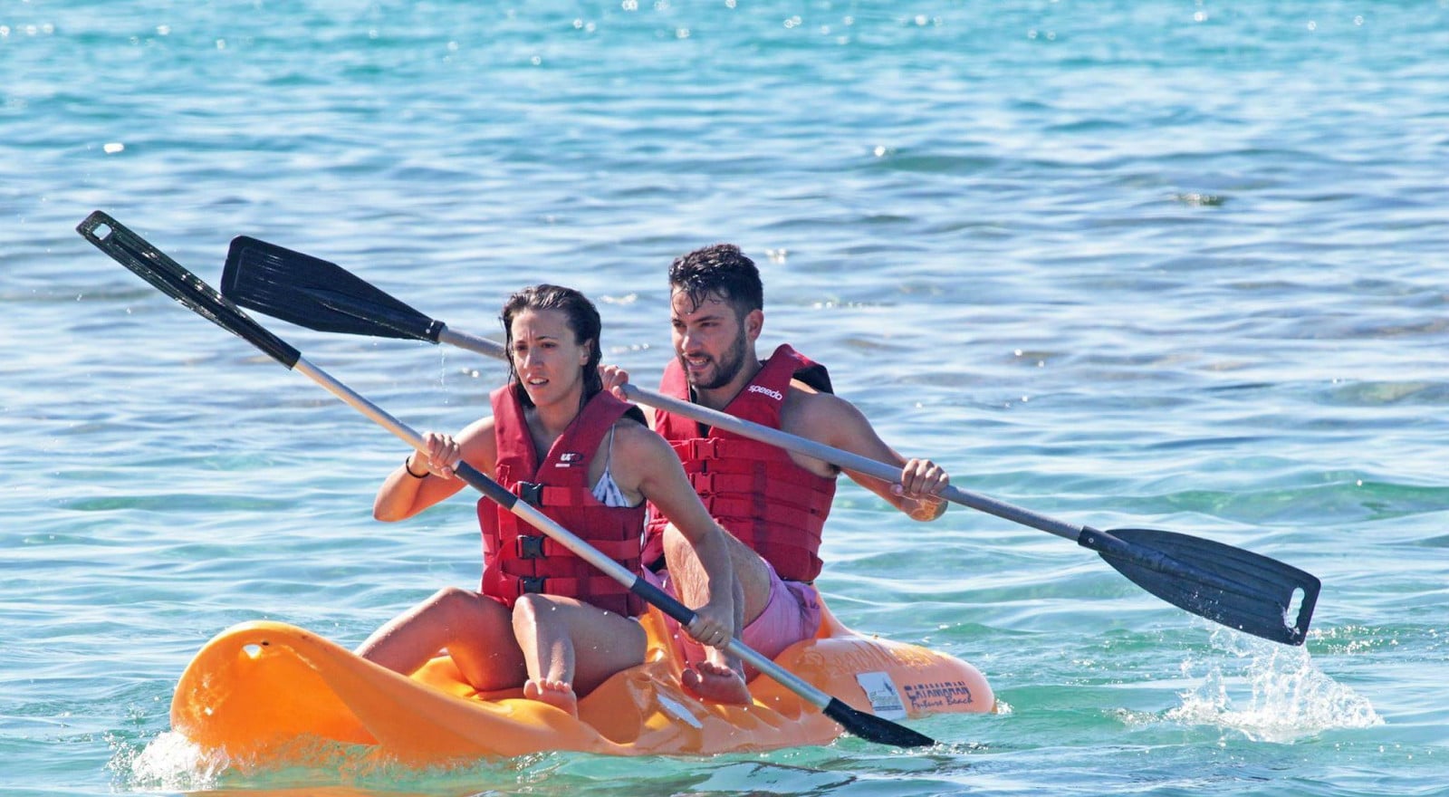 Couples enjoying kayaking on Laem Kho Kwang Beach