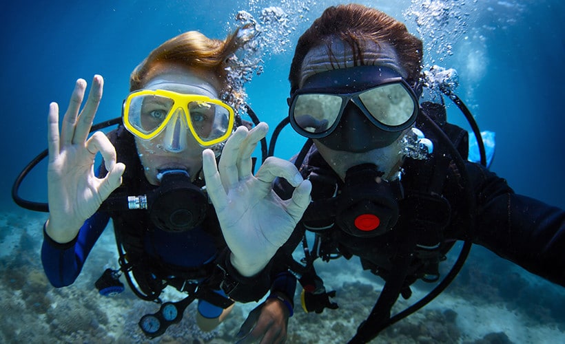 Tourists enjoying snorkeling on Nui Bay