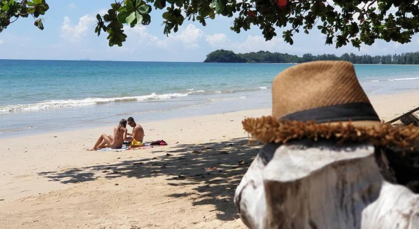 Visitors Sunbathing on Relax Beach