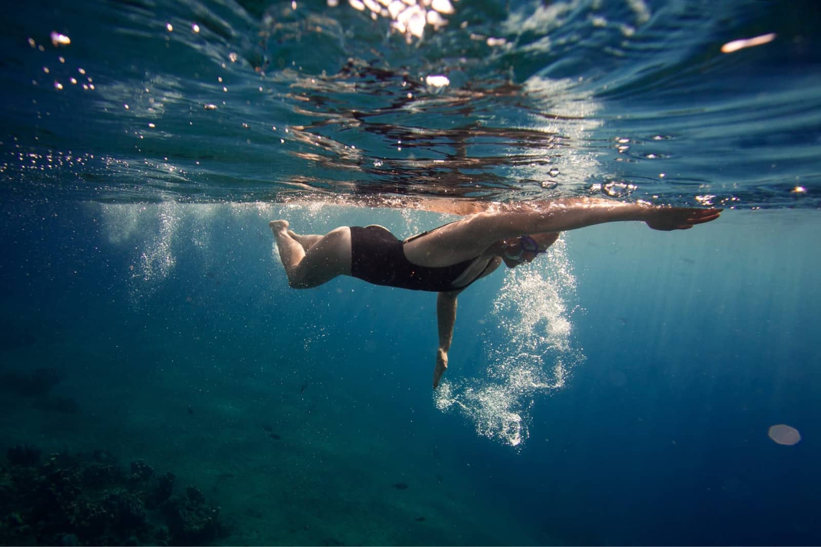 Tourist enjoying swimming on Laem Kho Kwang Beach