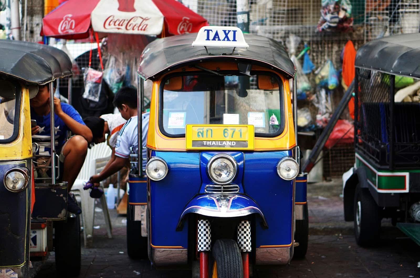 A blue and yellow tuk-tuk in Phuket