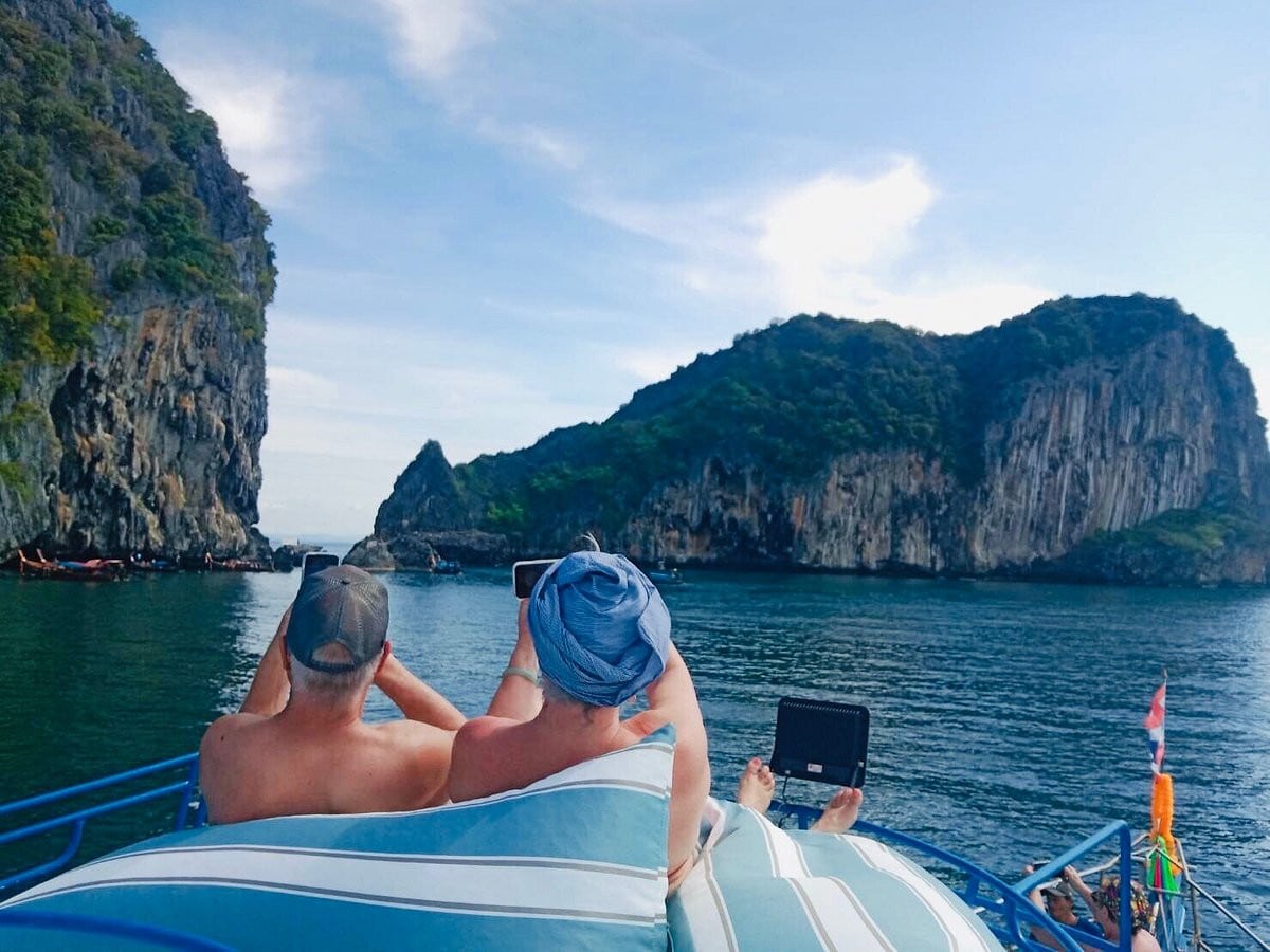 Tourists enjoying boat tours in Koh Lanta