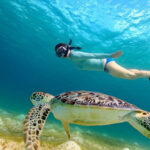 A tourist enjoying snorkeling in Koh Lanta