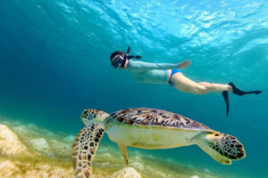 A tourist enjoying snorkeling in Koh Lanta