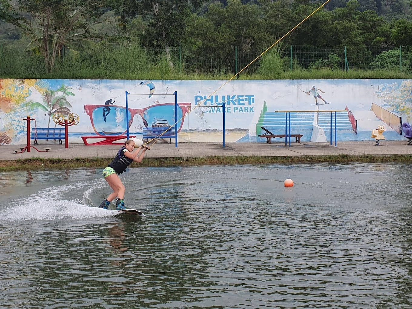 Kid wakeboarding at Phuket Wake Waterpark Kid Wakeboarding At Phuket Wake Waterpark