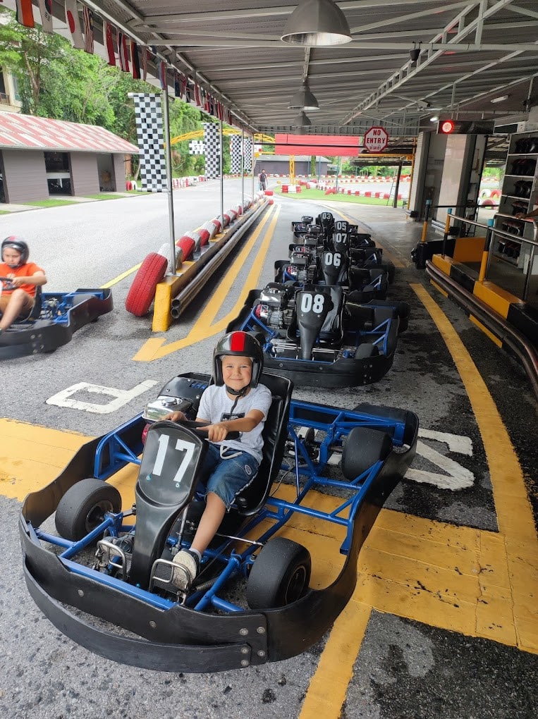 A Child Enjoying at the Patong Go-Kart Speedway A Child Enjoying At The Patong Go Kart Speedway