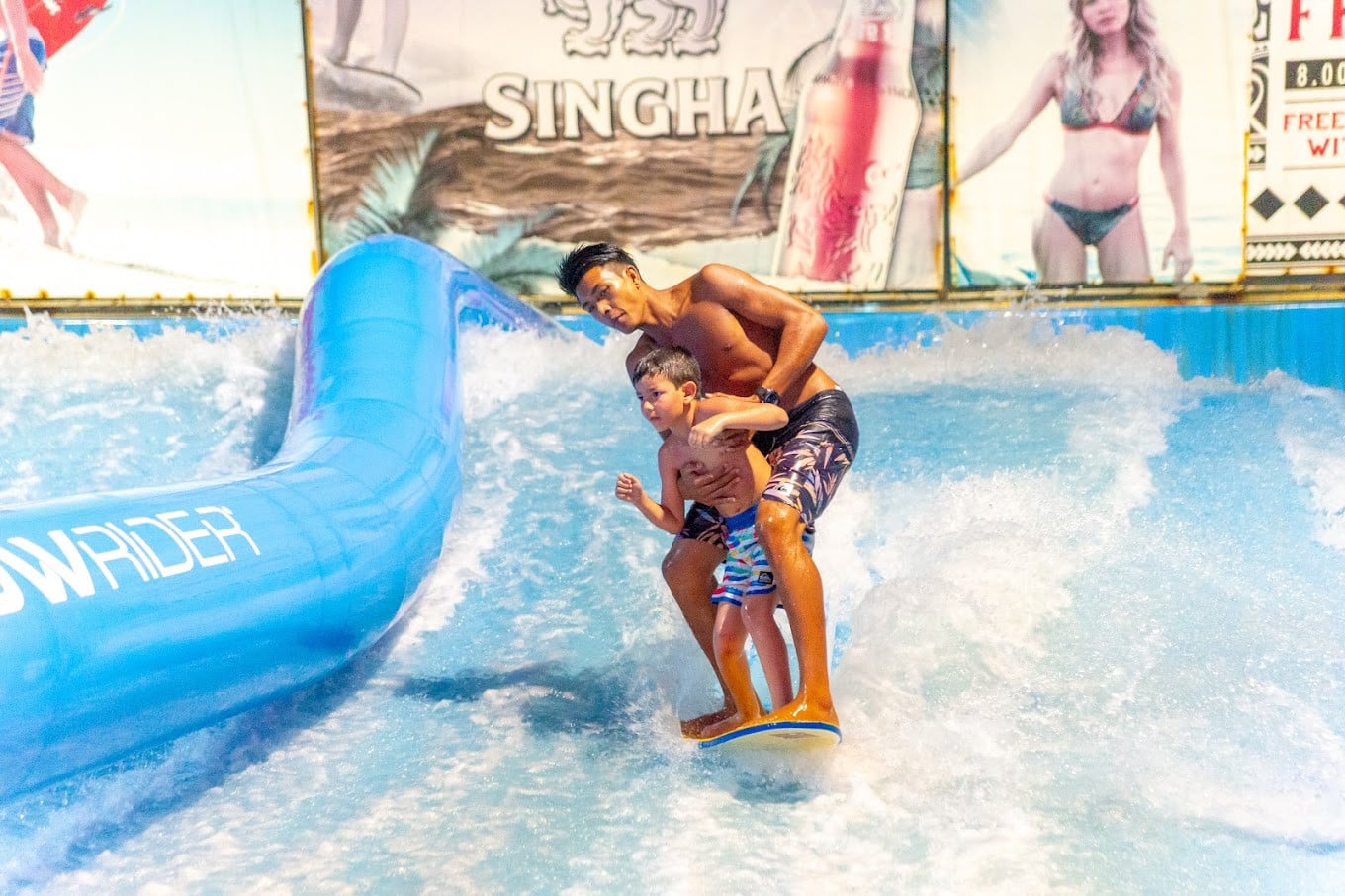 A Kid Learning Surfing At Surf House Phuket