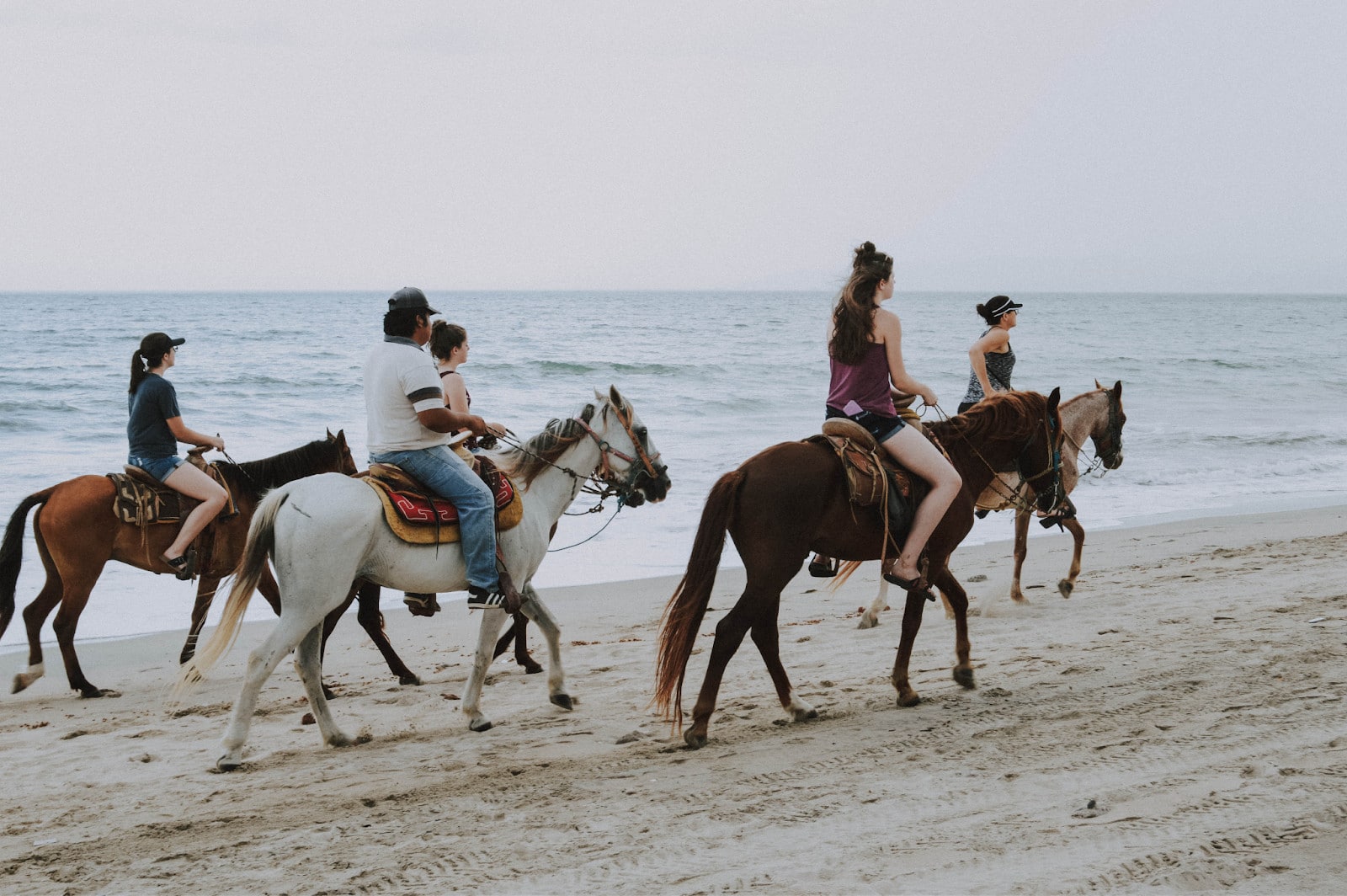 Kids Enjoying Horse Riding at the Beach Kids Enjoying Horse Riding At The Beach
